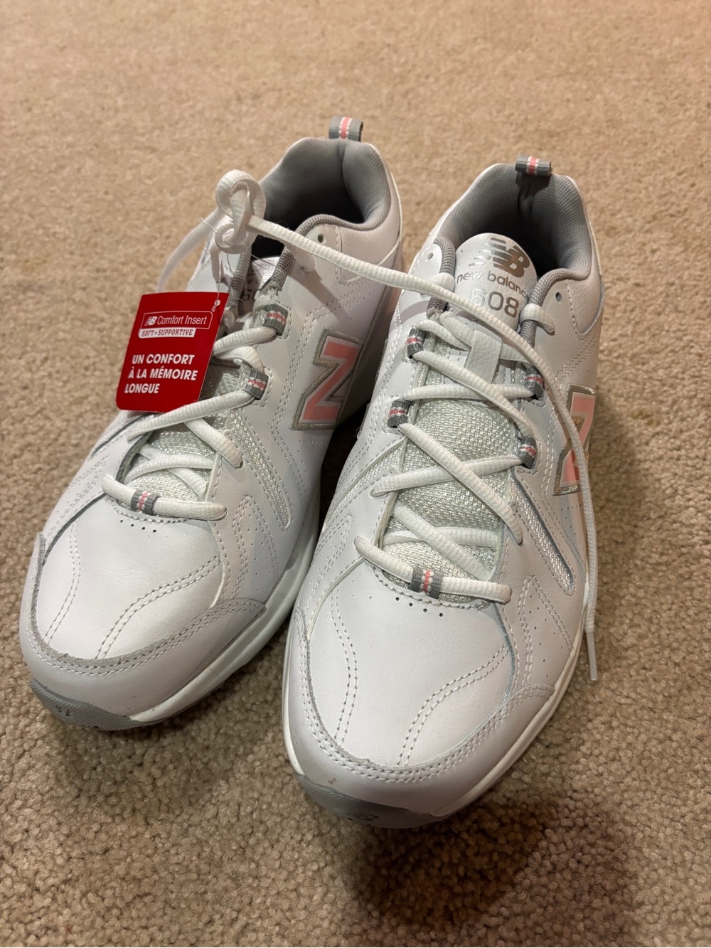 New Balance Women’s White Sneakers with Pink Accents